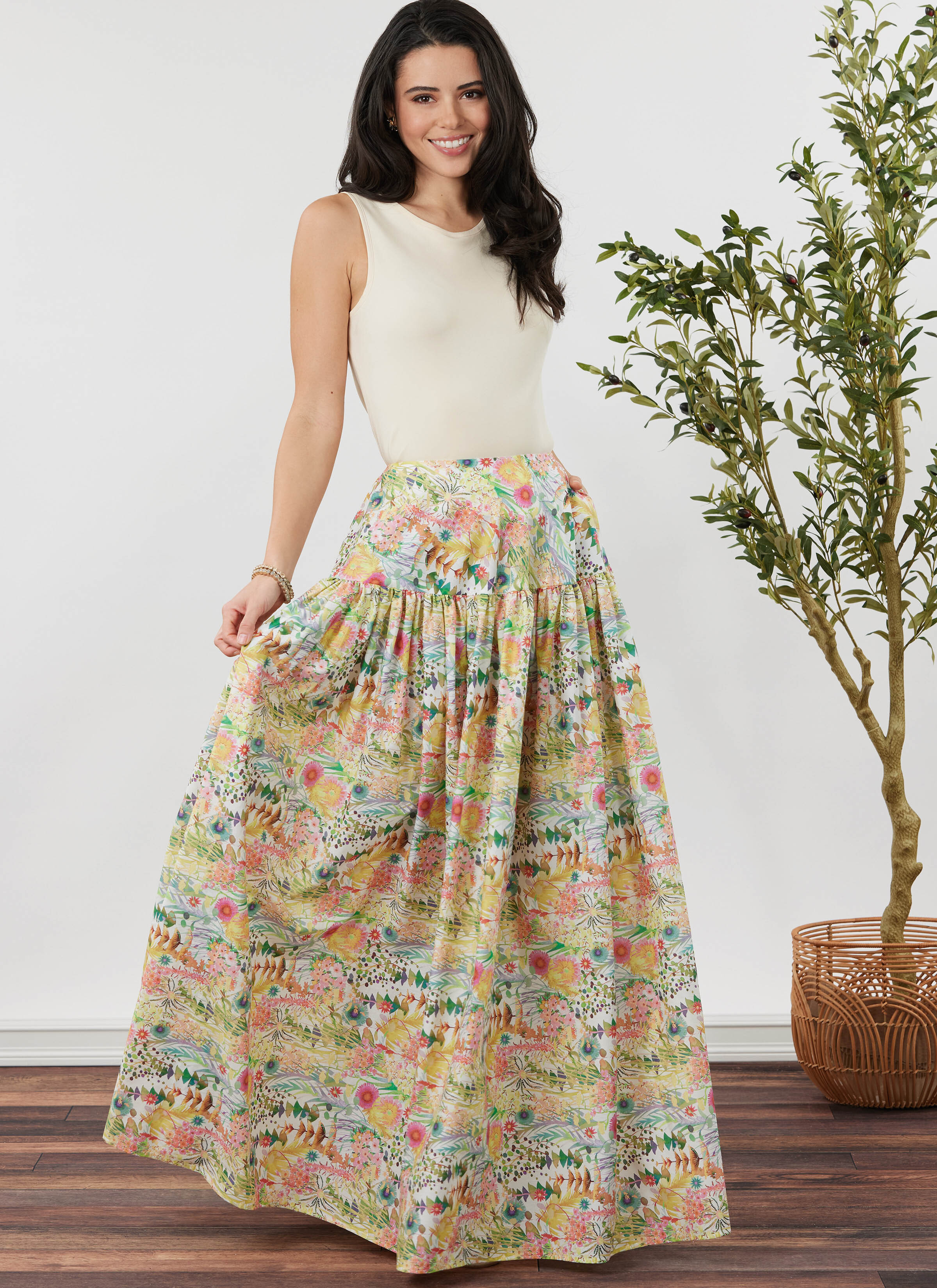 Woman wearing a full length maxi skirt in floral pattern.