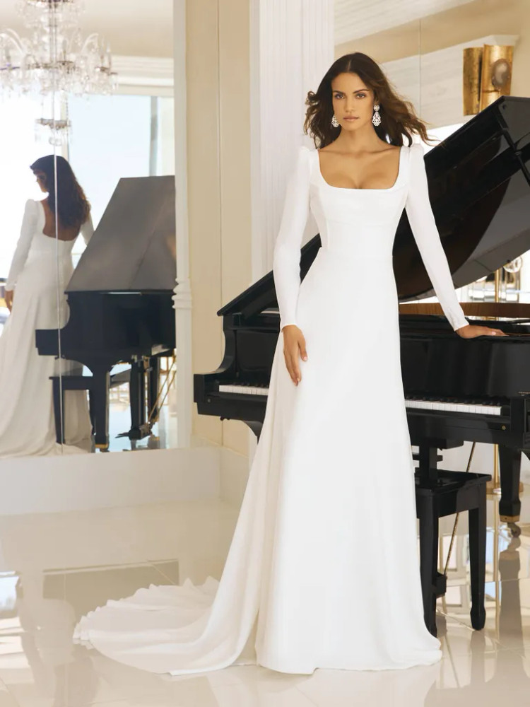 Betsy Flared crêpe wedding dress with square neckline and long sleeves by Pronovias 