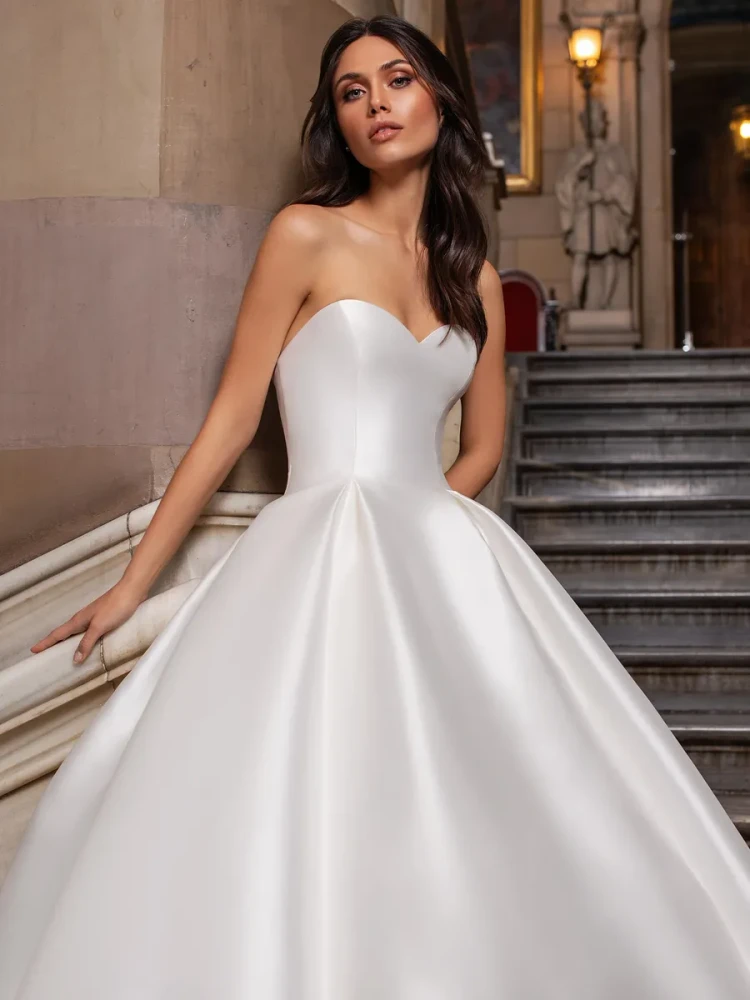 CLOSE Wedding Gown By Pronovias Princess wedding dress in mikado with sweetheart neckline, short sleeves and 