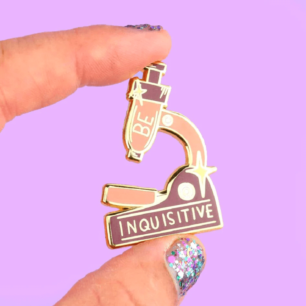 Jubly-Umph - Be Inquisitive Lapel Pin in the shape of a microscope is the perfect accessory for those who seek knowledge and have an inquisitive mind.