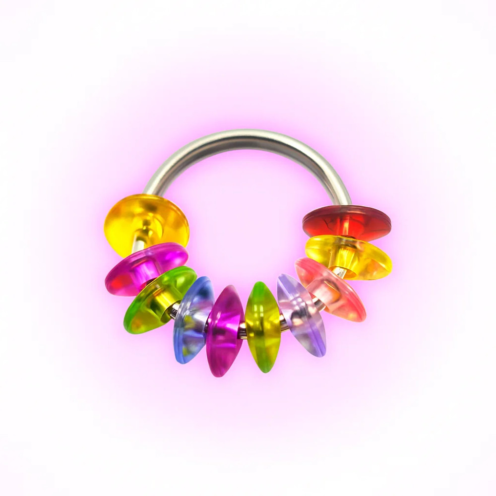 Dinky Things Fidgets - Rainbow Roller has a bunch of smooth saucer shaped rainbow beads that effortlessly glide along your fingers & have lots of room to spin around the ring