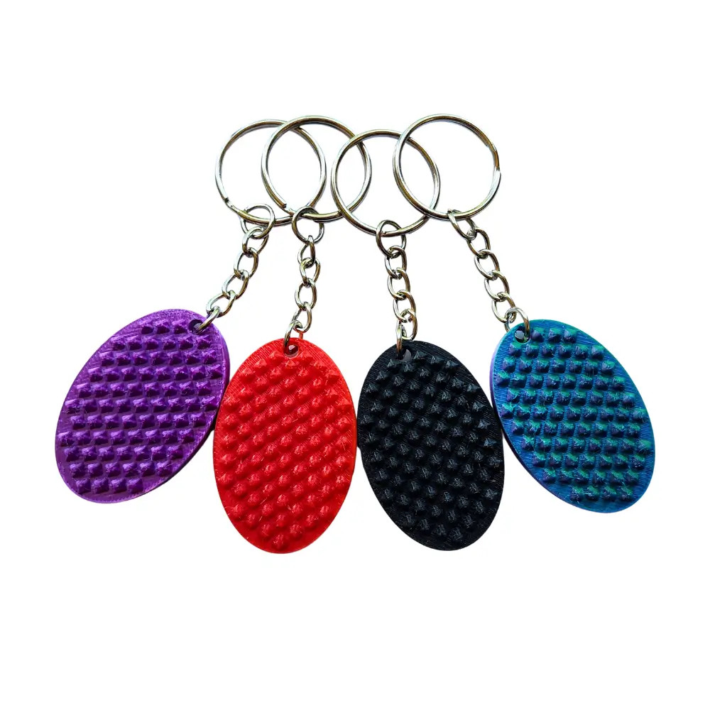 Introducing our Spiked Oval Mini Fidget Keychain – your pocket-sized sensory tool designed for intense tactile feedback whenever you need it.