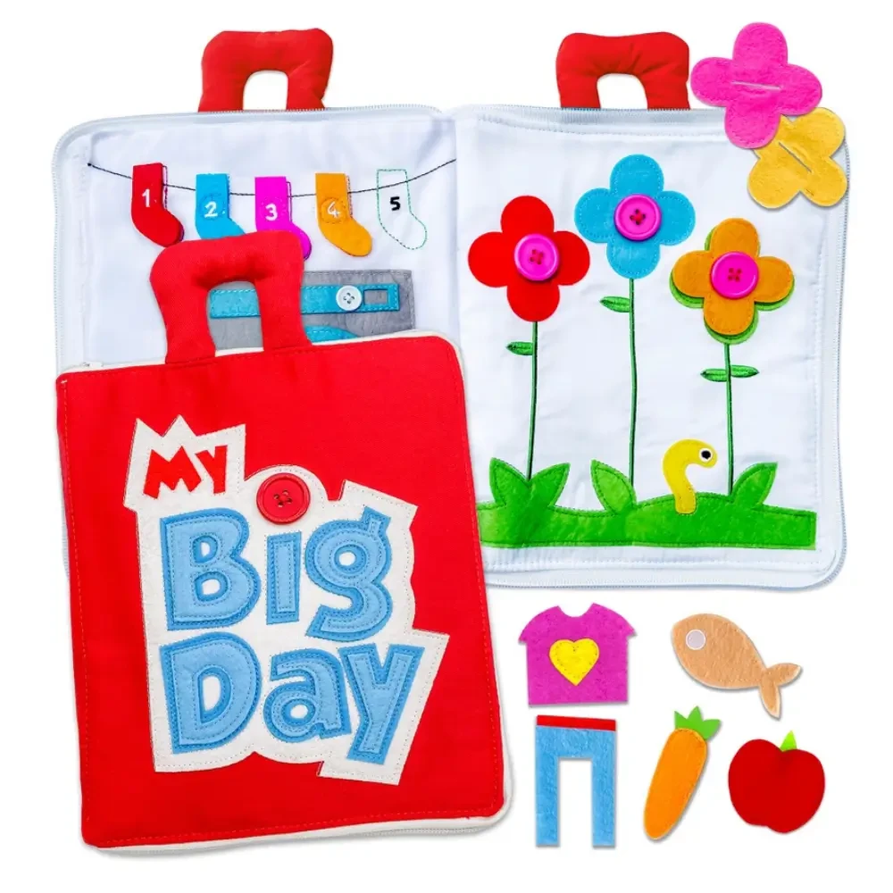Discover the Fabric Activity Book - My Big Day. A Montessori-inspired quiet book with 10 interactive pages that build fine motor skills, independence and everyday life skills through fun, screen-free learning.