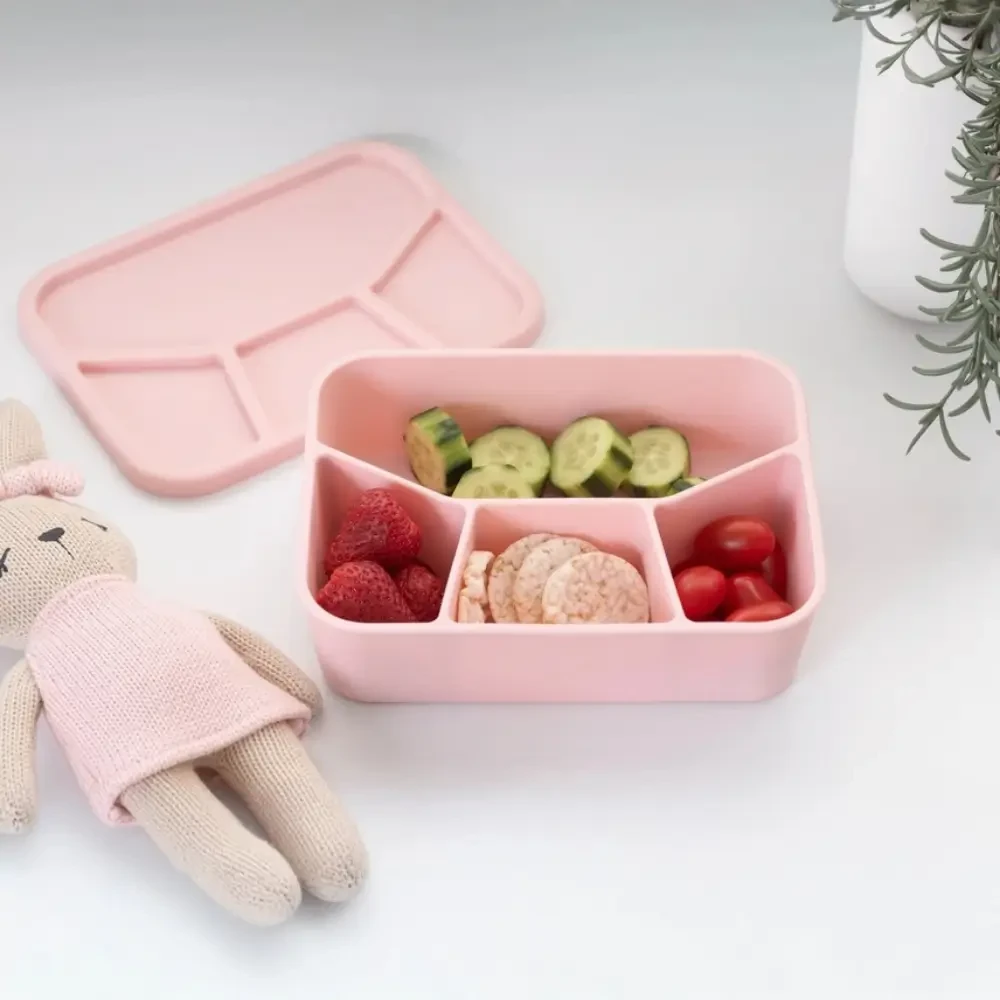 Keep lunches organised with this BPA-free Silicone Lunch Box featuring four separate compartments. Dishwasher and microwave safe and available in Sage or Pink.