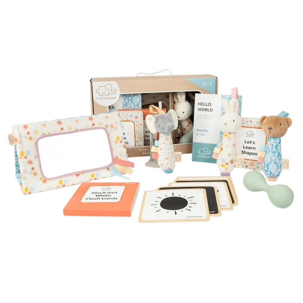 Discover the Playground Box 1 - Hello World Sensory Play Box for babies 0–3 months, with pram toys, rattle, tummy time mirror, flash cards, shapes book and play guide.