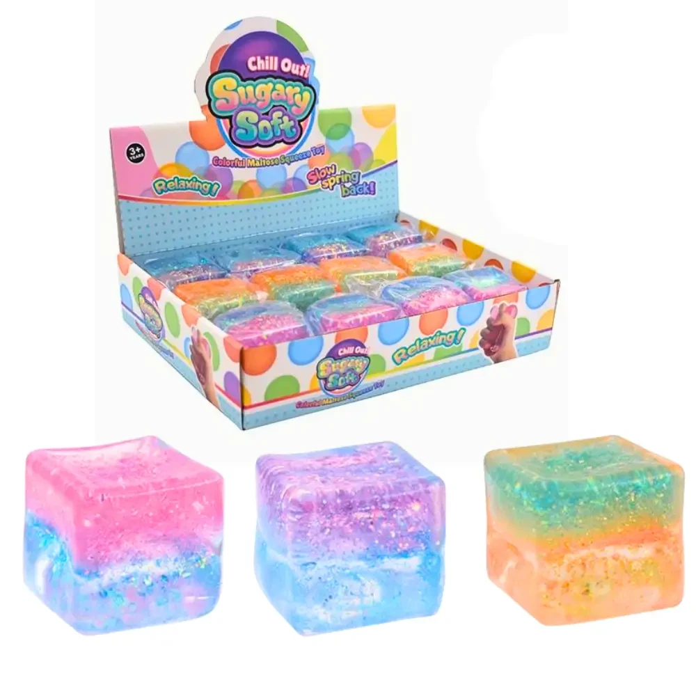Squeeze, squish and sparkle with the Squeeze Sugar Two Tone Glitter Block. A colourful 5 cm glitter-filled squishy cube perfect for sensory and fidget play.