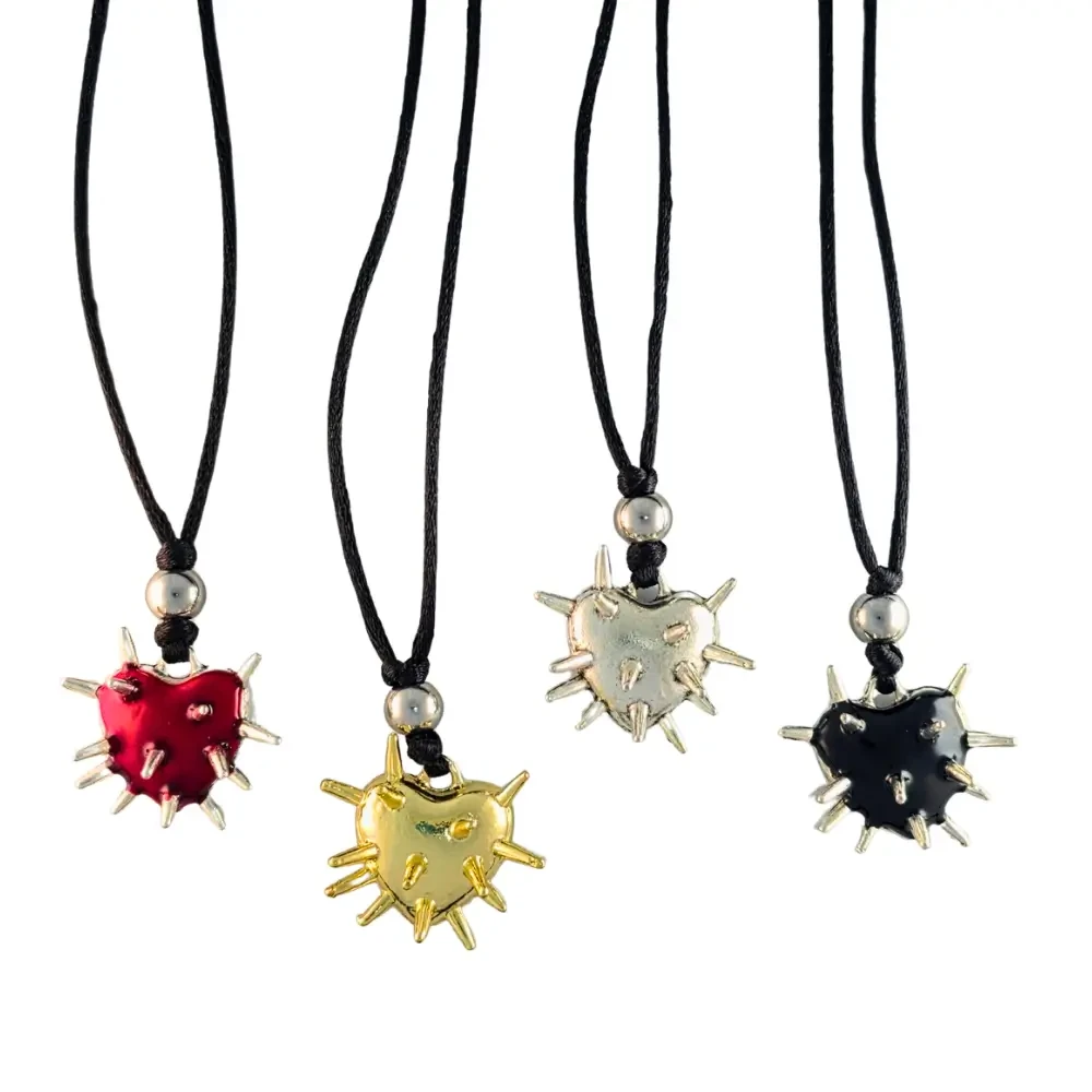 Handmade Cosmic Metal Fidgets - Heart Nebula Spiky Fidget Necklace with non-sharp spikes for strong tactile input and a smooth back for contrasting sensory feedback.
