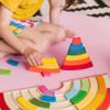 Building Rainbows is an open-ended puzzle at its finest- you chose where the pieces go! Develops problem solving, colour recognition and fine motor skills.