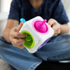Built into each side of this Fat Brain - Tugl Cube is a soft silicone bubble with a tab to grab and pull. Fingers can't help but push, pull and pop them!