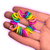 Dinky Things Fidgets - Rainbow Ring is an eye-catching fidget adorned with a kaleidoscope of smooth rainbow beads that effortlessly glide along your fingers.