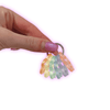 Dinky Things Fidgets - Twinkle Twist is a beautiful pastel rainbow of sparkly glittery hollow star shaped beads that make a lovely tinkly sound as you fidget.