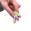 Dinky Things Fidgets - Rolly Ring is a mini fidget with cute little rainbow textured beads that are super satisfying to twist and twirl.