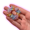 Dinky Things Fidgets - Shimmer Star Ring is a rainbow of colourful starry beads that make a satisfying sound as you fidget. The perfect pocket sized fidget!