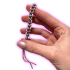 Dinky Things Fidgets - Metal Roller is a super star of the range consisting of smooth metal beads on a string that effortlessly glide along your fingers.