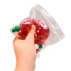 The Squeeze Jolly Ball is filled with shimmering gel, glitter, and fun textured pieces that move and shift as you squeeze, creating a fun sensory experience.