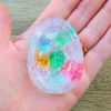 Handmade Sensory Stones - Sparkle Sea Worry Stone by Sensory Oasis for Kids. Smooth resin sensory stones with raised ocean-inspired details for tactile sensory input and pocket-sized calm.