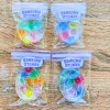 Handmade Sensory Stones - Sparkle Sea Worry Stone by Sensory Oasis for Kids. Smooth resin sensory stones with raised ocean-inspired details for tactile sensory input and pocket-sized calm.
