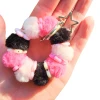 Meet the Dinky Things XL Fidgets - Fluffy Keychain, a soft tactile fidget with fluffy beads, colourful flower beads, a flexible wire centre and star keychain clip.