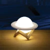 Bring cosmic magic into your space with the Colour Changing Saturn Planet Light! Features 4 colours, tap controls, rechargeable battery and wooden stand.