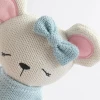 Meet Molly the Mouse, a soft 100% cotton knitted toy with a pale blue dress, matching bow and embroidered details. Perfect for cuddles, comfort and sensory play.