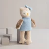 Meet Ollie the Owl, a soft 100% cotton knitted toy with fluffy wings, embroidered features and a cosy blue dress. Perfect for cuddles and sensory play.