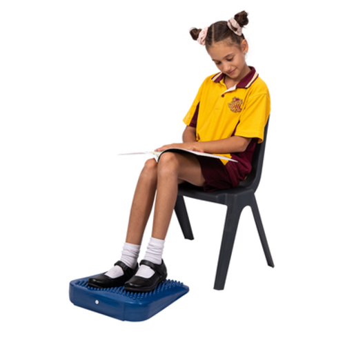 Elizabeth Richards - Tactile Foot & Support Wedge enables movement while working as the deep pressure fosters the ability to stay on task.