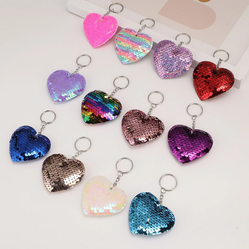 Add a touch of sparkle and affection to your everyday accessories with this enchanting Sequin Heart Keychain! The perfect little take anywhere fidget!