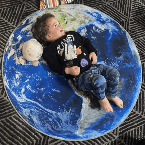 Step into a world of exploration and discovery with our Earth Rug! This plush, soft rug transforms any child's room into a cosy haven, inviting imaginative play and relaxation.