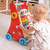 Busy Baby Deluxe Walker is an engaging and activity-packed wooden baby walker designed to help develop motor skills, coordination, and sensory exploration.
