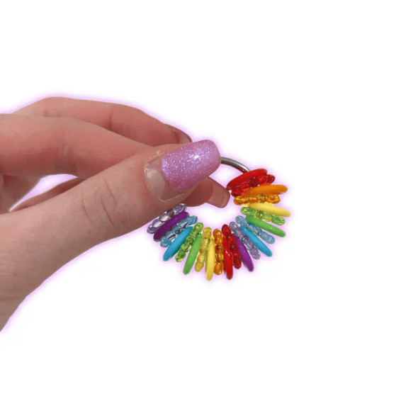 Dinky Things Fidgets - Clicky Ring has a mixture of bumpy & smooth beads in a rainbow of colours & makes a lovely little sound as you jiggle it in your hands.