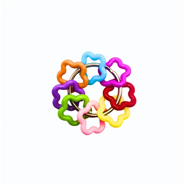 Dinky Things Fidgets - Starry Swirl is a rainbow of colourful starry beads that make a sweet tinkling sound as you fidget.