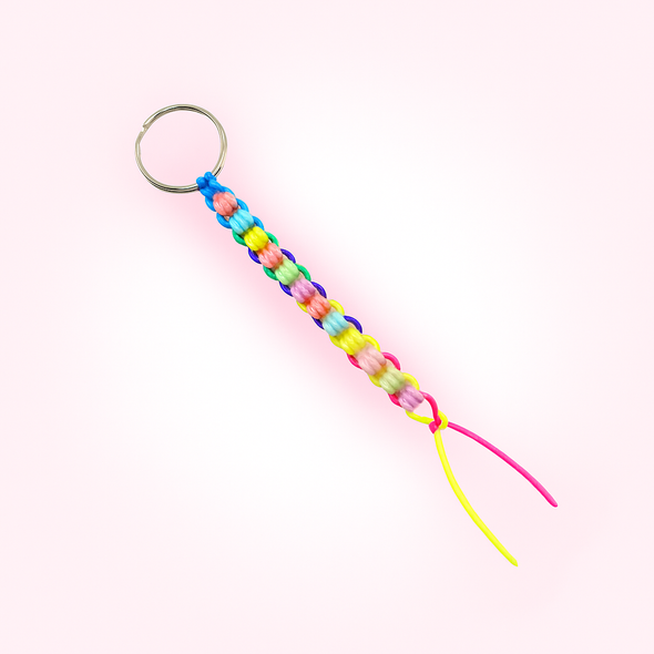 Dinky Things Fidgets - Barrel Roller is a combination of colourful textured beads on a string with a ring at the top that effortlessly glides along your fingers