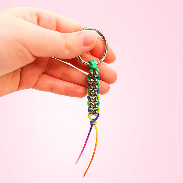 Dinky Things Fidgets - Double Metal Roller is a star of the range with smooth metal beads strung in groups of two on a string that glide along your fingers.