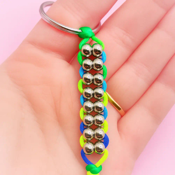 Dinky Things Fidgets - Double Metal Roller is a star of the range with smooth metal beads strung in groups of two on a string that glide along your fingers.