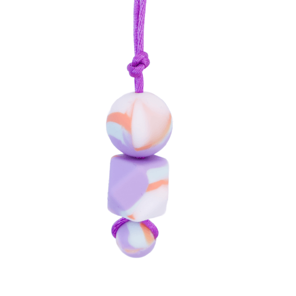 The Tie Dye Adult Chew Necklace seamlessly marries the retro charm of tie-dye with the modern need for sensory relief.