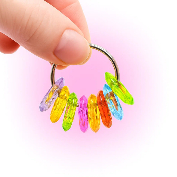 Dinky Things Fidgets - Tinkle Rings is a gorgeous fidget with textured round beads that make a sweet tinkling sound for fun sensory input.