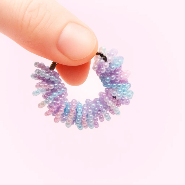 Dinky Things Fidgets - Pearly Hearts is a gorgeous fidget with textured heart shaped beads that make a sweet tinkling sound for fun sensory input.