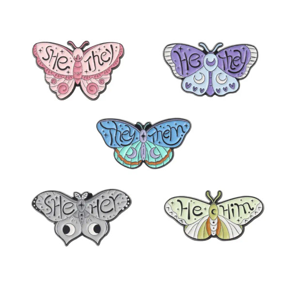 Cute Butterfly Pronoun Pin in 5 designs: She/They, He/They, They/Them, She/Her, He/Him. Inclusive, secure and perfect for bags, lanyards & jackets.