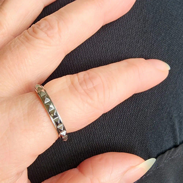 Anxiety Spinner Ring - Mini Spikes is a beautiful and functional accessory designed to help manage anxiety and restlessness.