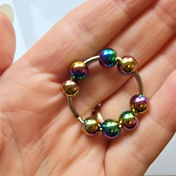 Let this smooth and elegant Cosmic Metal Fidgets - Luna Rainbow become your pocket-sized companion for sensory relief, mindfulness and calm.