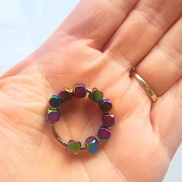 Let this adorable and elegant Cosmic Metal Fidgets - Neptune become your pocket-sized companion for sensory relief, mindfulness and calm.