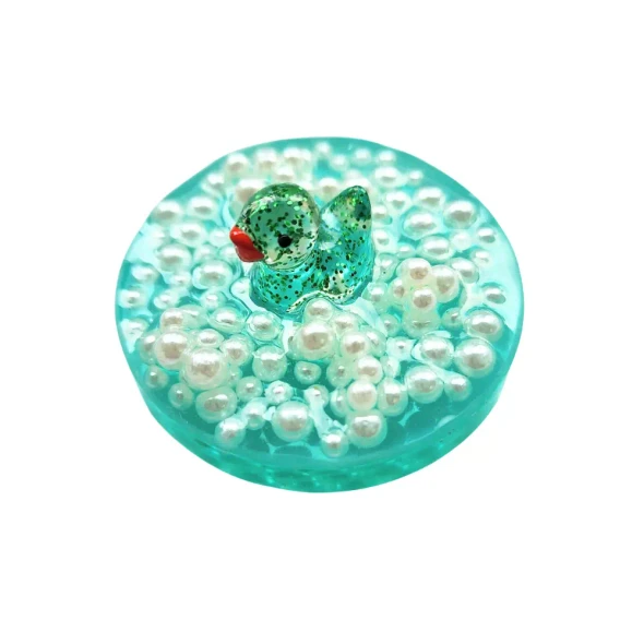 Handmade Sensory Stones - Bubble Bath Duck Fidget by Sensory Oasis for Kids. Cute resin fidgets with raised pearl-style bubbles for tactile sensory input.