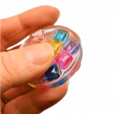 Handmade Sensory Stones - Rainbow Blocks Fidget by Sensory Oasis for Kids, featuring sparkly resin and colourful raised rainbow block details for tactile sensory fun.