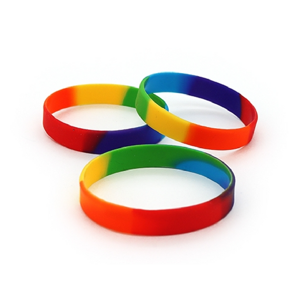 Elevate your style with this vibrant Rainbow Silicone Bangle! Made from mildly flexible silicone, this bangle sports a rainbow of colours that will surely brighten up day.
