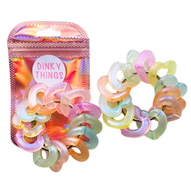 Dinky Things XL Fidgets - Tinkle Hearts is a bigger, chunkier version of our original Tinkle Hearts with smooth pearlescent heart beads, gentle sound and satisfying fidget movement.