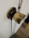 doorknob inside of the home holding a Bouncy Ball Real Rabbit Fur Handmade String Cat Toy on it's handle