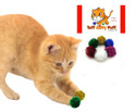 orange tabby kitten batting 2 green and gold tuff kitty puff mini size sparkle poms cat toy