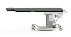 Oakworks CFPM301 Imaging Table with integrated headrest, flat cushioned top, motorized base, and wheeled support frame. Oakworks CFPM301 Imaging Table with integrated headrest, flat cushioned top, motorized base, and wheeled support frame.