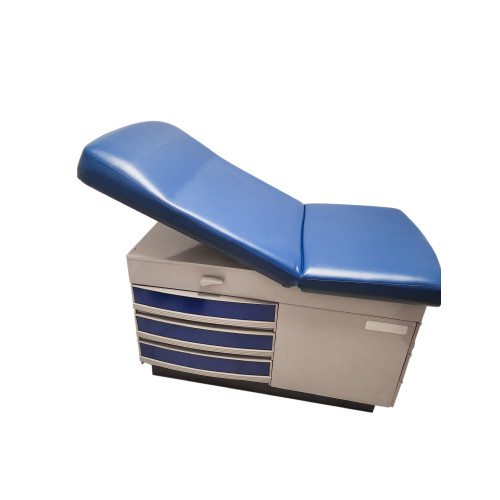 Midmark Ritter 304 examination table with bright blue upholstered top and silver base, featuring three side drawers with blue panels and curved handles.