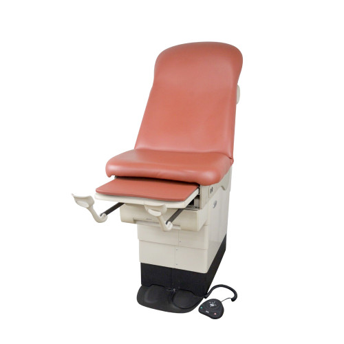 Midmark 623 barrier-free with terra cotta upholstery, stirrups, and foot control.